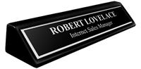 Black Metal Name Plate with Silver Engraving and Shiny Silver Border on an 8" Black Piano Finish Deskplate